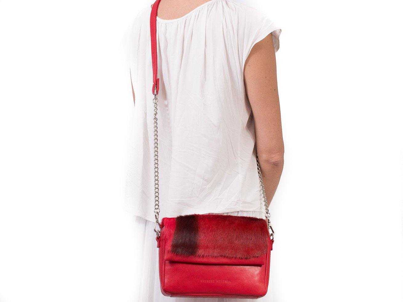 sherene melinda springbok hair-on-hide red leather shoulder bag Stripe context