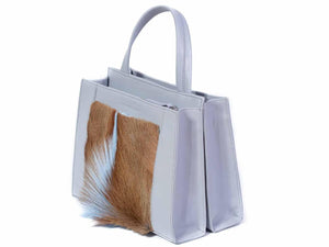 Top Handle Springbok Handbag in Baby Blue with a fan feature by Sherene Melinda side angle