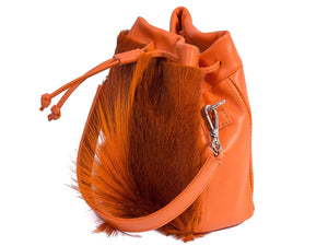 sherene melinda springbok hair-on-hide orange leather pouch bag Fan side angle