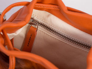 sherene melinda springbok hair-on-hide orange leather pouch bag inside