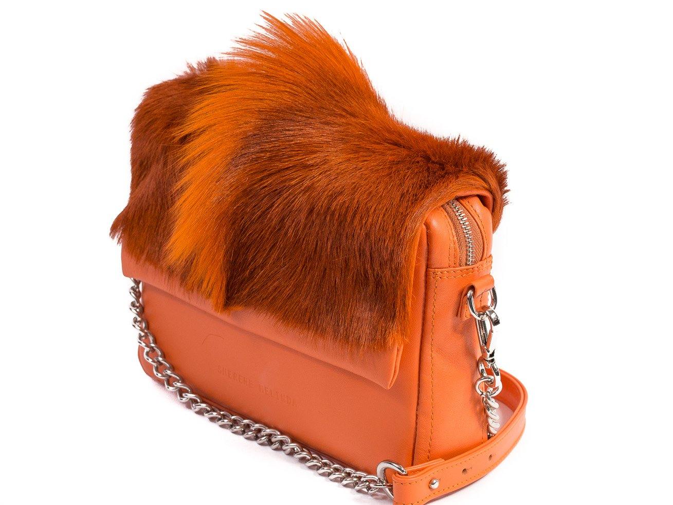 sherene melinda springbok hair-on-hide orange leather shoulder bag Fan side angle strap