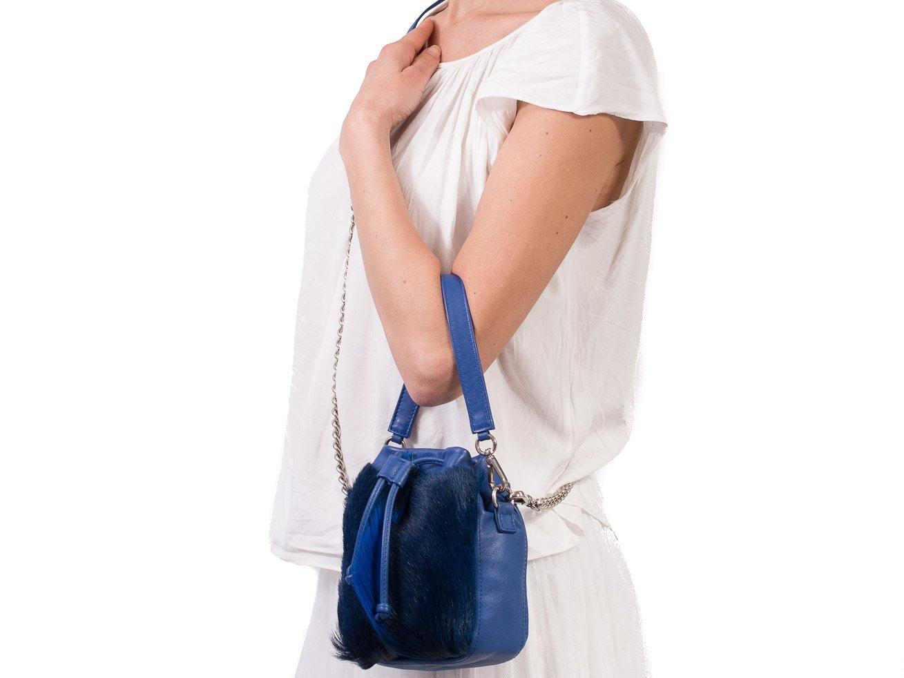 sherene melinda springbok hair-on-hide royal blue leather pouch bag fan context